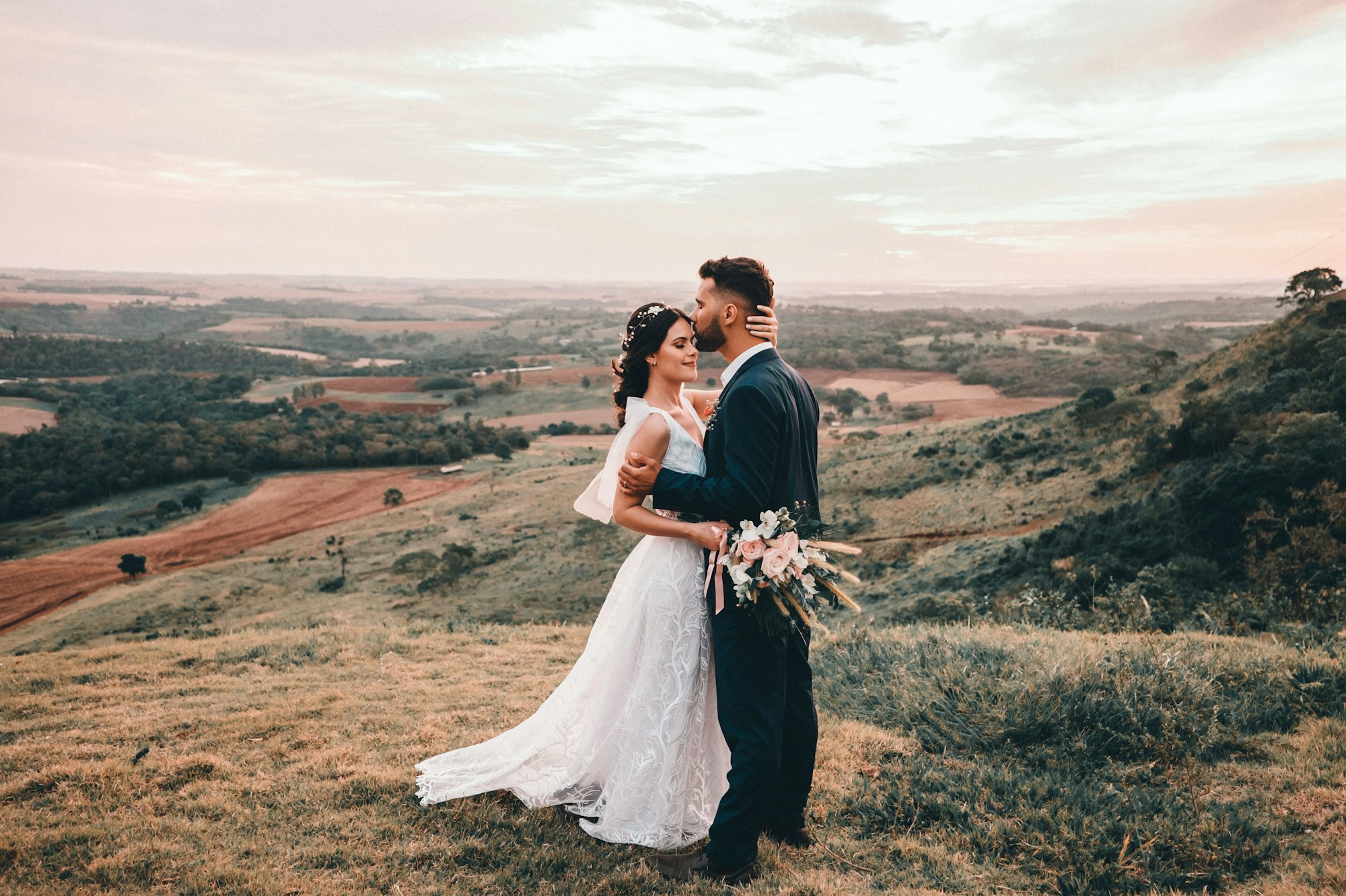 Couple on a hill at sunset