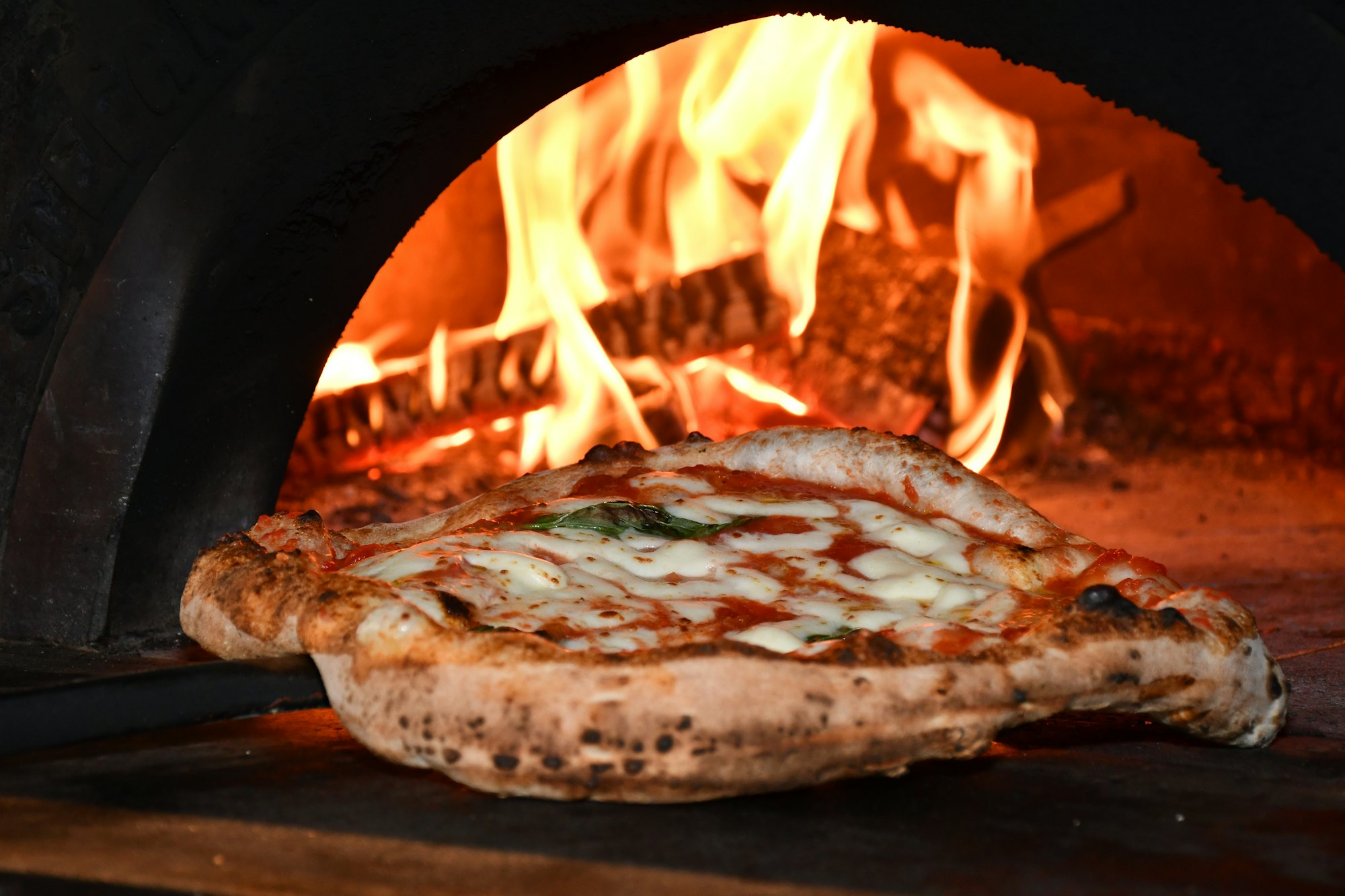 Pizza in a wood-fired oven
